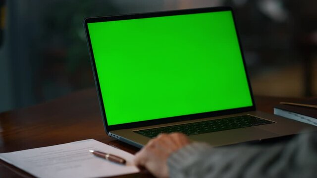 Green screen laptop computer closeup. Unknown senior man having video call 