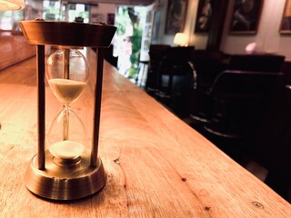 hourglass on old table