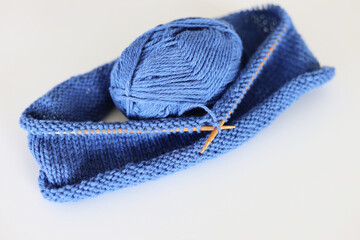 Simple photo of knitting in blue wool yarn