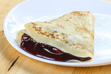 Delicous pancake with fruit jam