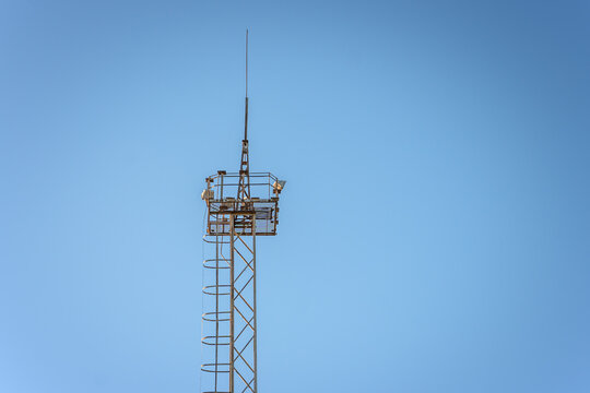 A metal tower with a lightning rod