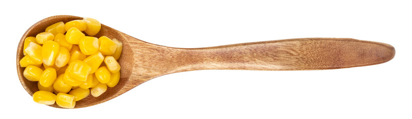 Wooden spoon with raw corn seeds isolated on white background. Raw fresh corn close up.