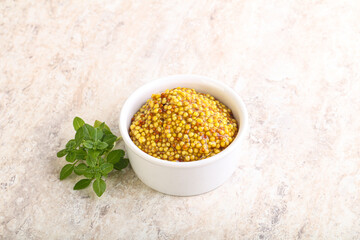 Grain mustard sauce in the bowl