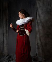A noble lady in a luxurious red dress, medieval style, a young woman