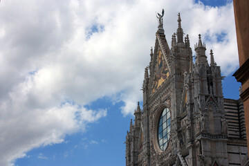 Fototapeta na wymiar The Metropolitan Cathedral of Santa Maria Assunta or also the Duomo of Siena on a beautiful sunny day