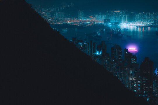 Modern City With Skyscrapers Illuminated With Blue Neon Lights At Night