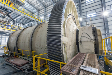 View of industrial ball mill. A ball mill is a type of grinder used to grind or blend materials for...