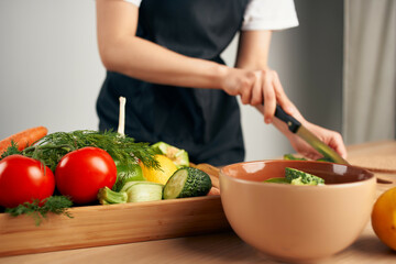 Obraz na płótnie Canvas cutting vegetables salad vitamins healthy food