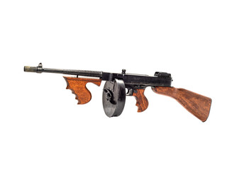 Thompson submachine gun with cartridge magazine isolated on white background.