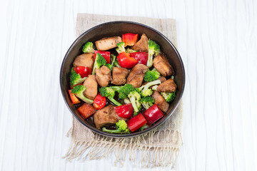 Chicken fried and vegetable broccoli pepper in bowl