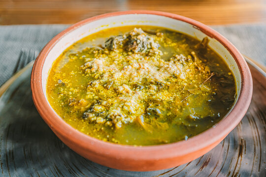 Traditional Armenian herbal soup with aveluk or horse sorrel. The concept of folk cuisine and healthy vegetarian dishes