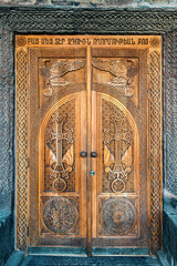 entrance to the church of St. Gayane in Armenia with a wooden carved door