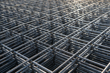The rebar is bonded with steel wire for use as a construction infrastructure. Which part of the rebar has rusted due to chemical reactions. - obrazy, fototapety, plakaty