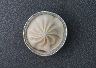 handmade steamed Shanghai Xiao long bao pork meat dumpling soup on dark grey wood background dim sum menu