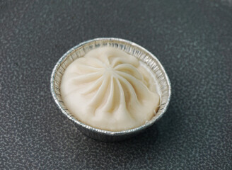 handmade steamed Shanghai Xiao long bao pork meat dumpling soup on dark grey wood background dim sum menu