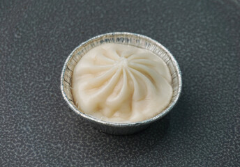 handmade steamed Shanghai Xiao long bao pork meat dumpling soup in plate on dark grey wood table asian dim sum halal food restaurant cuisine banquet menu for cafe