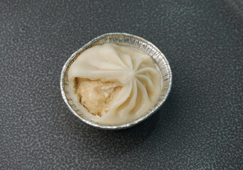 handmade steamed Shanghai Xiao long bao pork meat dumpling soup on dark grey wood background dim sum menu