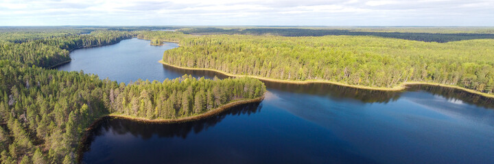 Aerial panorama with a beautiful forest lake. The system of Siya lakes, Arkhangelsk region, Russia.