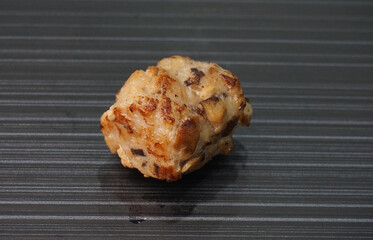 deep fried pork meatball with scallop and mushroom and chilli dip on dark grey wood background dim sum menu