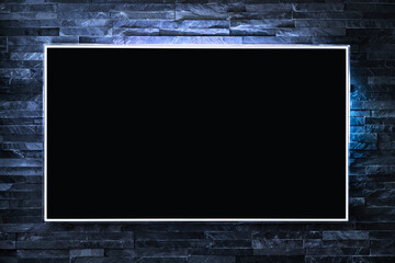 Tv screen on wall at night in dark with led light. Television and flat smart monitor display on...