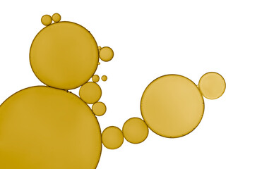 Abstract oil droplets with golden colour  isolated on white background.