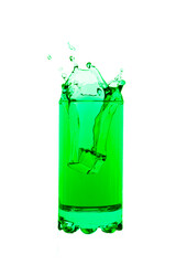 Lime green splashing out of glass creating an art shape isolated on white background.