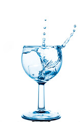 Water splash in glass isolated on white background.