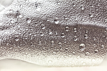 Water drops on the foil . Aluminium foil with water condensation