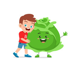 cute little boy stands with cabbage character