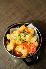 Popcorn shrimp with tomatoes and chives