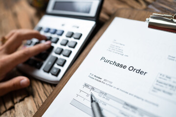 Fototapeta premium Person Hand Filling A Purchase Order Form