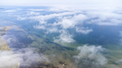 Aerial View from of the fog forest and the sea