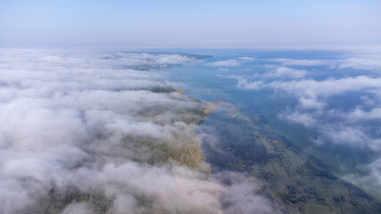 Aerial View from of the fog forest and the sea