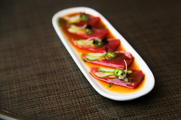 Raw tuna appetizer with spicy sauce