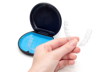 Transparent aligners and storage case. Invisible braces. Clear teeth straighteners. plastic bracers