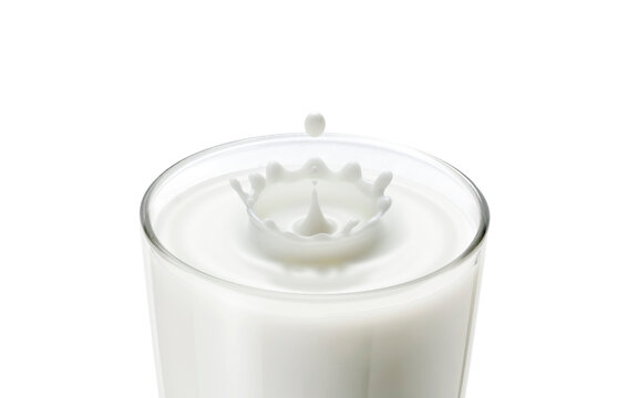 Closeup Of Milk Drop In Glass Create Ripple Wave And Splash In Crown Shape. Dropping Milk In Milk Glass Make Wave And Splash In Crown Shape Show Fresh Milk, Healthy Food, Breakfast Drink Concept.