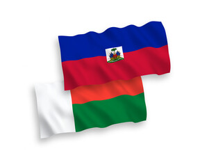 Flags of Republic of Haiti and Madagascar on a white background