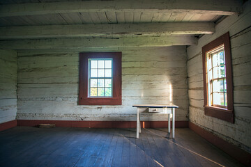 Interior of log cabin and county park.