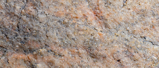 Granite surface. Texture of granite stone. Cracked natural stone surface. Copy space