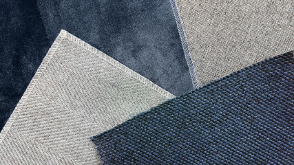 close up combination of fabric samples background in blue and grey tone. multi pattern of fabric. interior material concept background (focused on blue linen fabric).