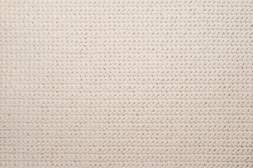 Close up of threaded beige textile