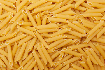 Background of raw penne pasta