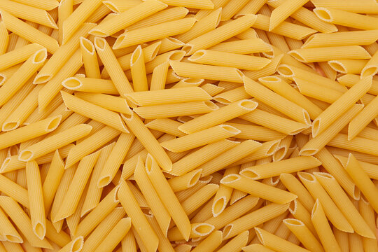 Background Of Raw Penne Pasta