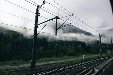Railroad railway train tracks forest mountain city village town rural central 
