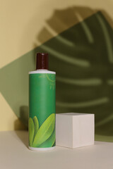 Eco friendly Bottle or jar with natural skincare cosmetics, creams or oils on light background. Plant-based beauty products