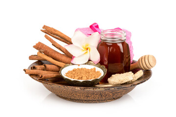 Face mask with cinnamon and honey isolated on white background.