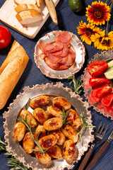 Delicious hot fried sausages and other food on the table