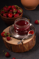Delicious sweet strawberry jam and fresh ripe berries