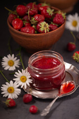 Delicious sweet strawberry jam and fresh ripe berries