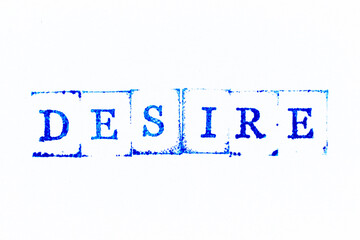 Blue color ink rubber stamp in word desire on white paper background